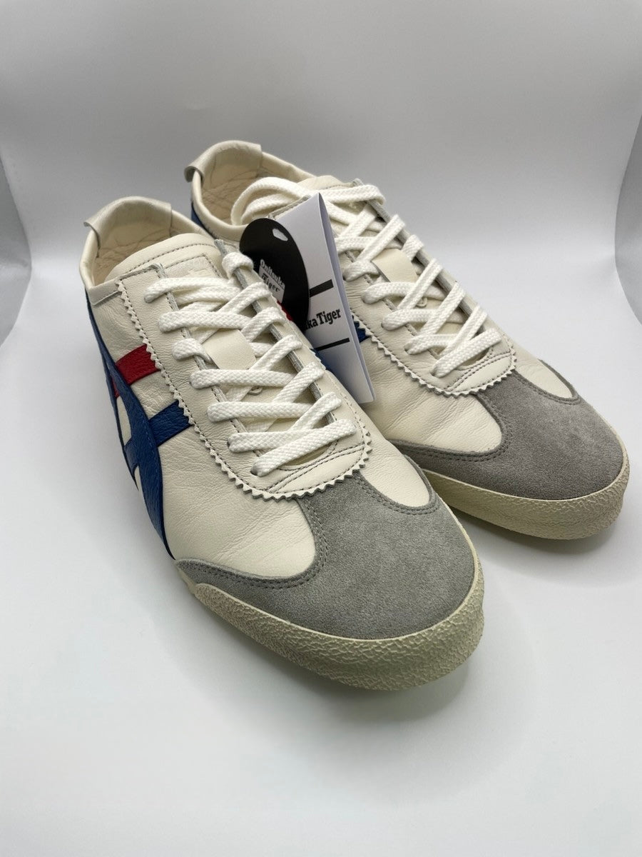 Onitsuka Tiger Mexico 66 Deluxe Nippon Made sneakers in white, blue, and red.