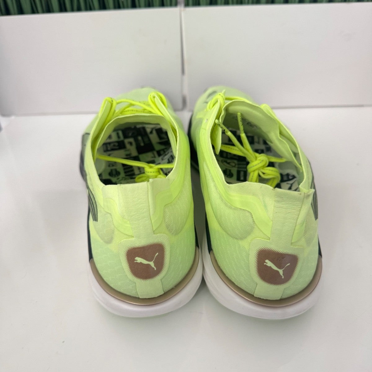 Puma Liberate Nitro 2 Run 75 Running Shoes in a neon yellow colorway with metallic bronze heel branding
