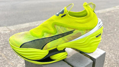 The Puma Fast-RB Nitro Elite PR in the striking Lime Pow-Poison Pink-PUMA Black colorway