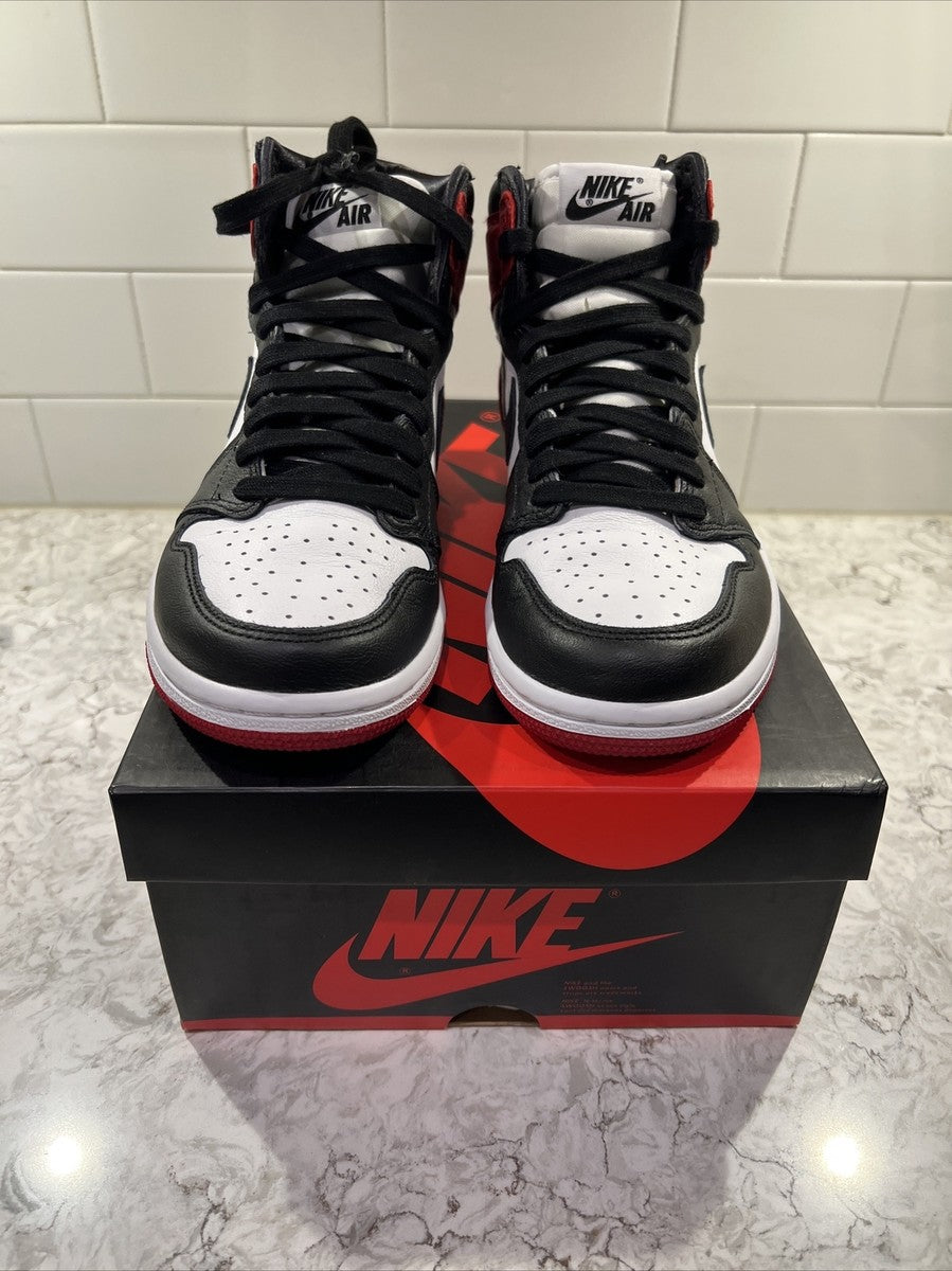 Jordan 1 Retro High OG 'Satin Black Toe', showcasing a lustrous red