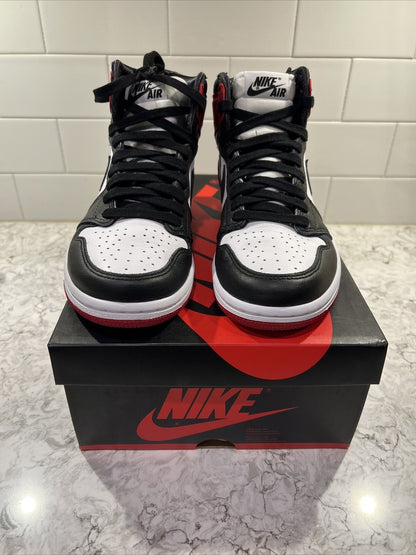 Jordan 1 Retro High OG 'Satin Black Toe', showcasing a lustrous red