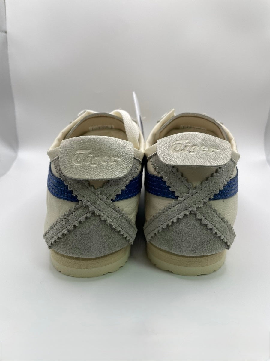 Onitsuka Tiger Mexico 66 Deluxe Nippon Made sneakers in white, blue, and red.