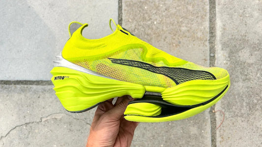 The Puma Fast-RB Nitro Elite PR in the striking Lime Pow-Poison Pink-PUMA Black colorway