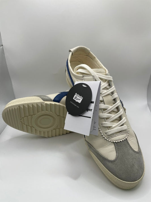 Onitsuka Tiger Mexico 66 Deluxe Nippon Made sneakers in white, blue, and red.