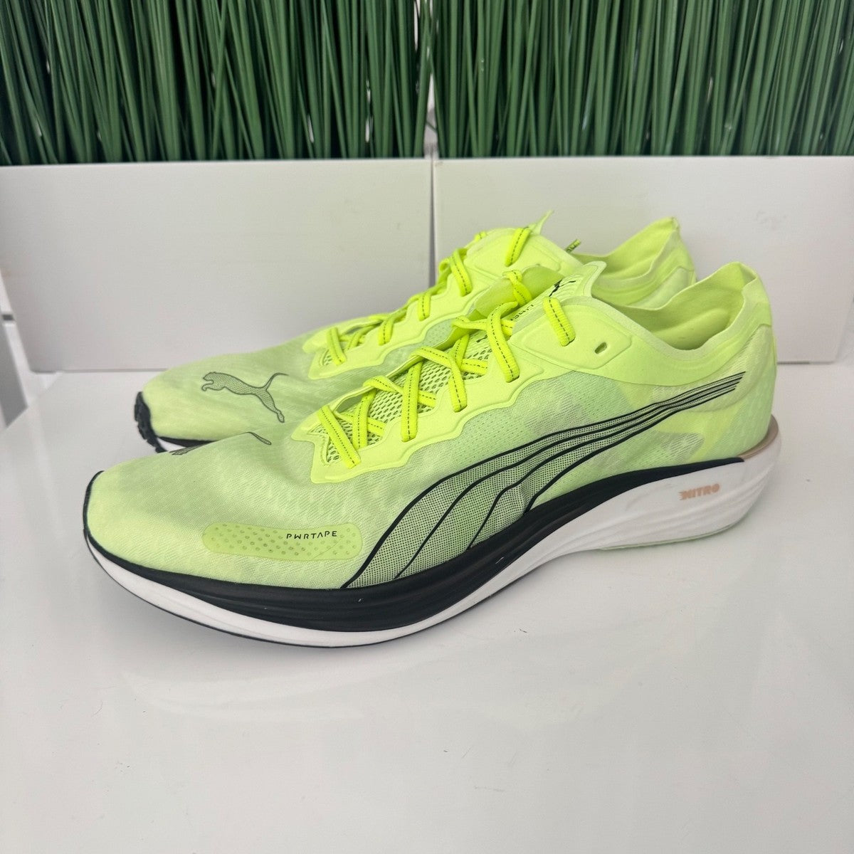 Puma Liberate Nitro 2 Run 75 Running Shoes in a neon yellow colorway with metallic bronze heel branding