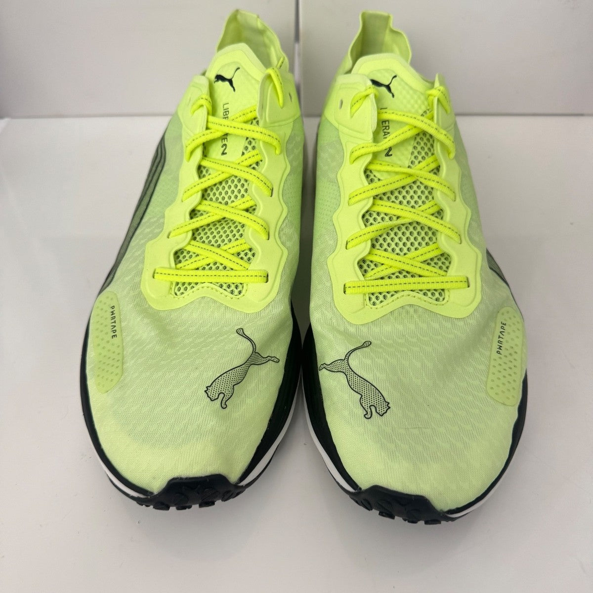 Puma Liberate Nitro 2 Run 75 Running Shoes in a neon yellow colorway with metallic bronze heel branding