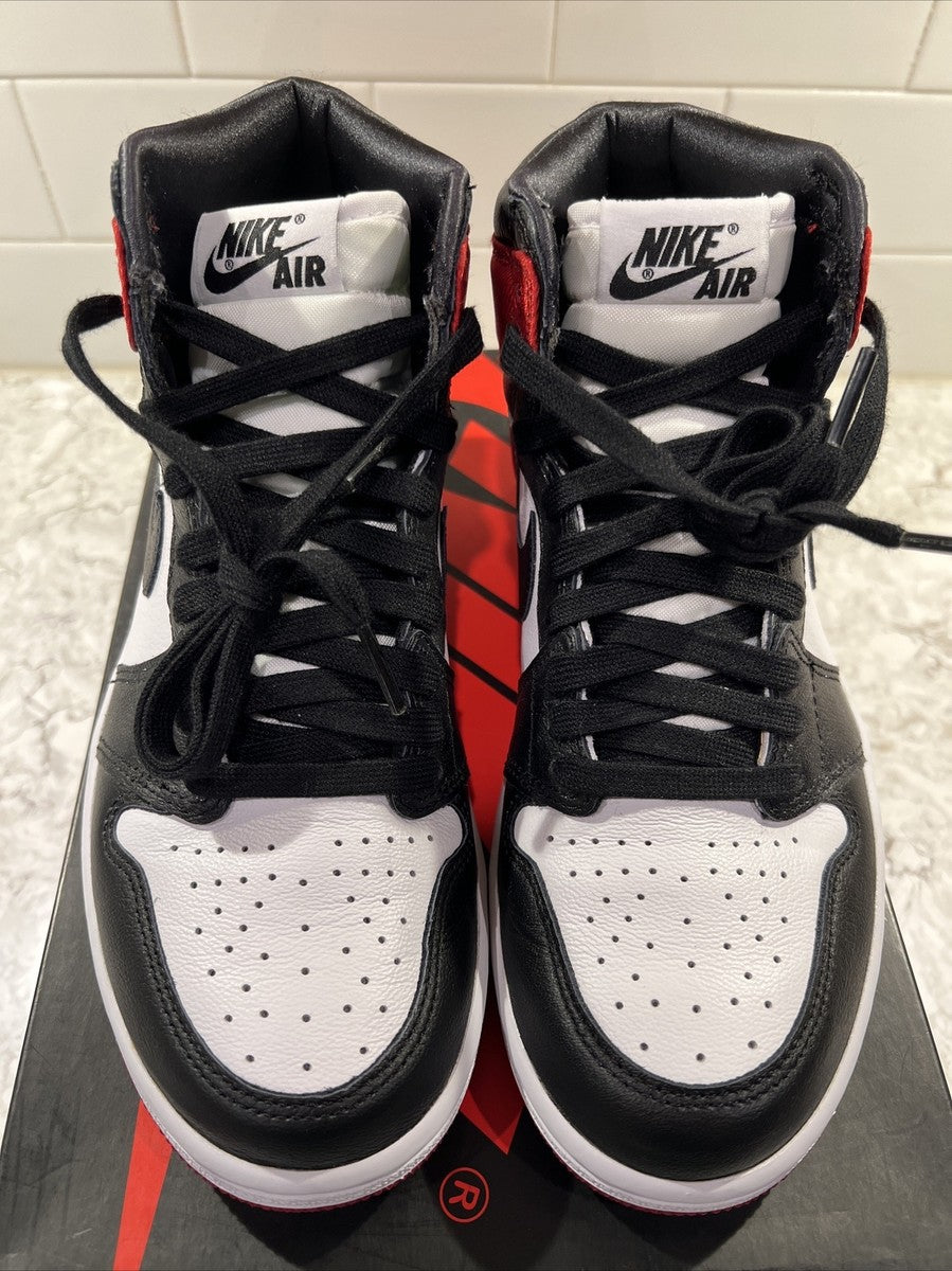 Jordan 1 Retro High OG 'Satin Black Toe', showcasing a lustrous red