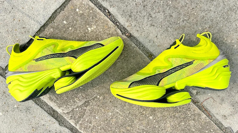The Puma Fast-RB Nitro Elite PR in the striking Lime Pow-Poison Pink-PUMA Black colorway