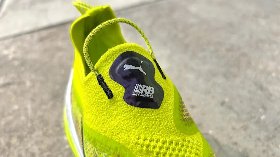 The Puma Fast-RB Nitro Elite PR in the striking Lime Pow-Poison Pink-PUMA Black colorway