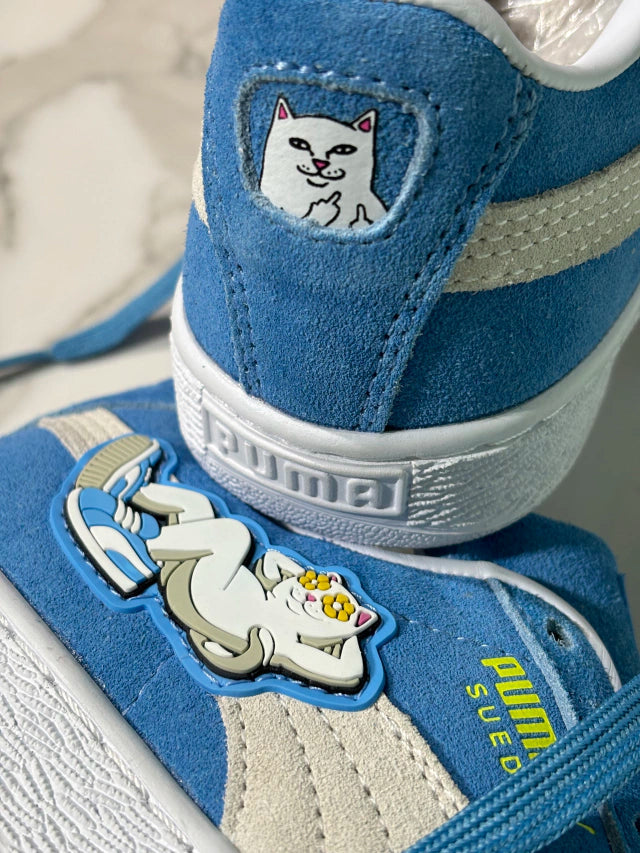 The PUMA x RIPNDIP Suede sneaker in Regal Blue features a distinctive silicone